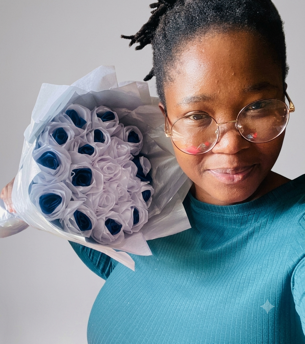 Eurenda Fusion Tech florist holding a handcrafted ribbon rose bouquet